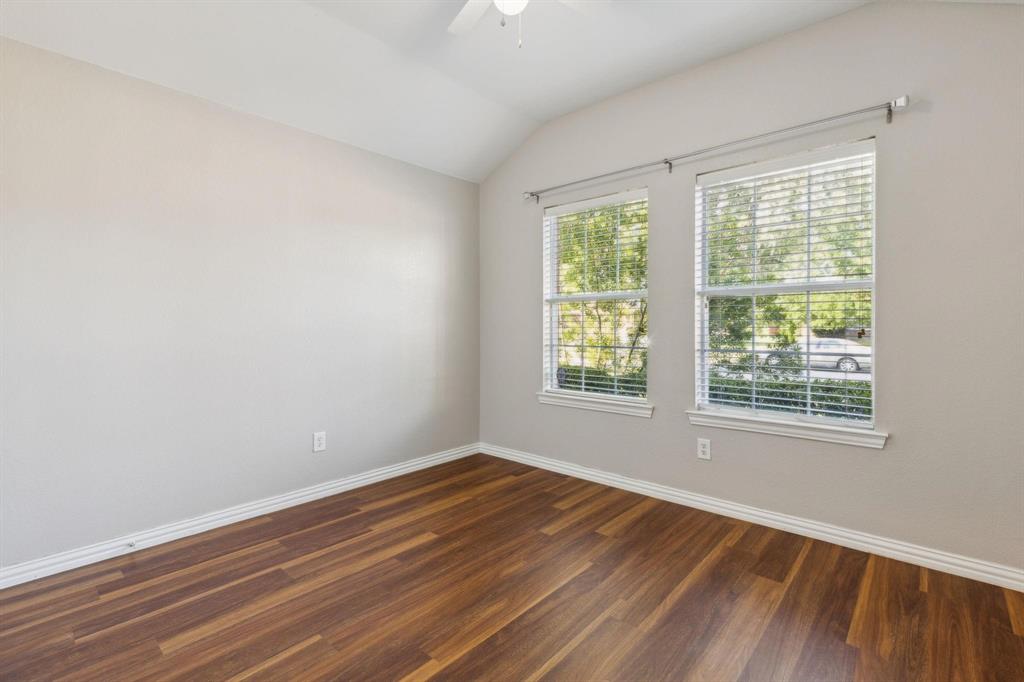 4401 Sycamore Road Melissa, TX 75454 - Photo 18 of 22 a view of an empty room with wooden floor and a window