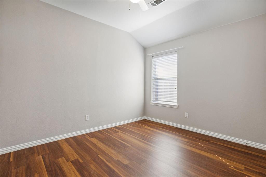 4401 Sycamore Road Melissa, TX 75454 - Photo 19 of 22 an empty room with wooden floor and windows