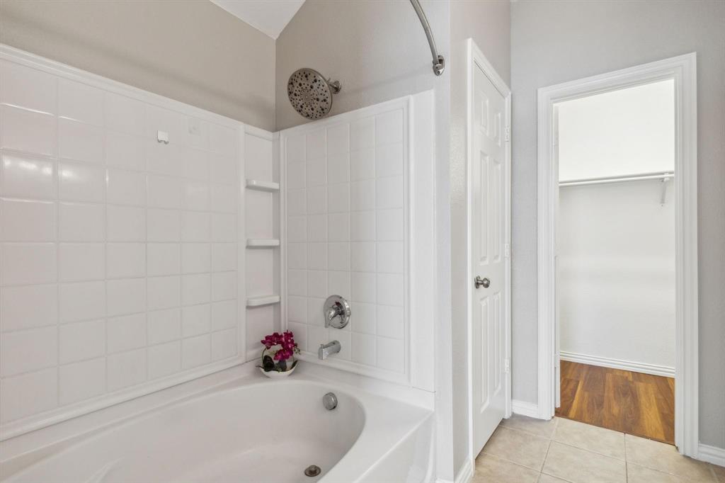 4401 Sycamore Road Melissa, TX 75454 - Photo 21 of 22 a bathroom with a bathtub and a shower