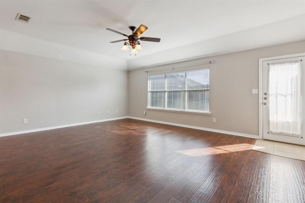 4401 Sycamore Road Melissa, TX 75454 - Photo 9 of 22 a view of empty room with wooden floor and fan