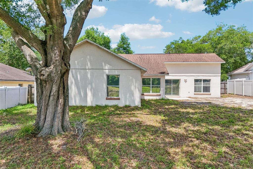 2596 Alclobe Circle Ocoee, FL 34761 - Photo 7 of 70 a backyard of a house with seating space