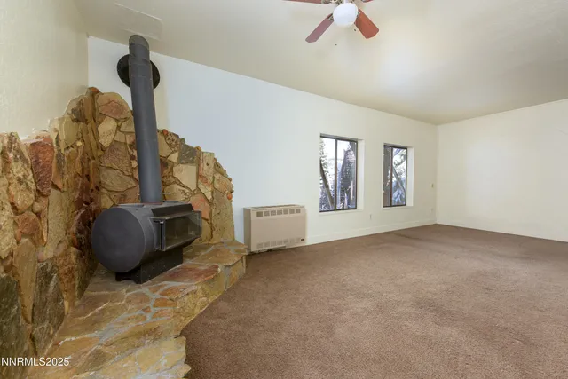 a bed room with a bed and a television