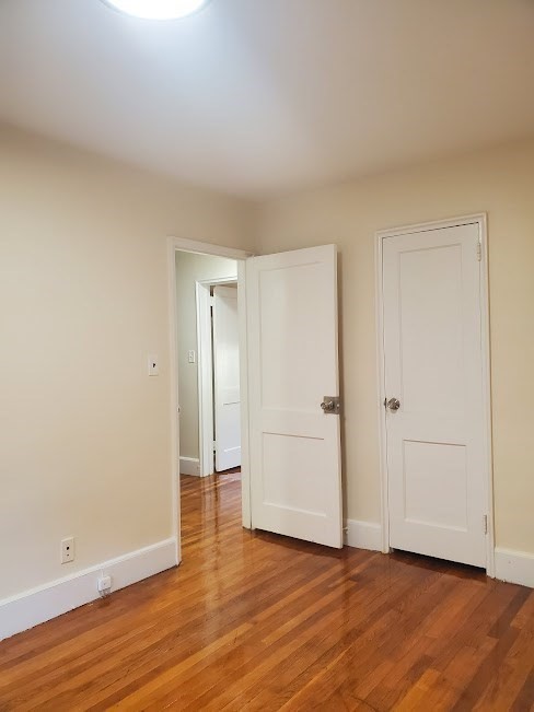 9 Victory Road, Unit 13 Boston, MA 02122 - Photo 14 of 14 a view of an empty room and wooden floor