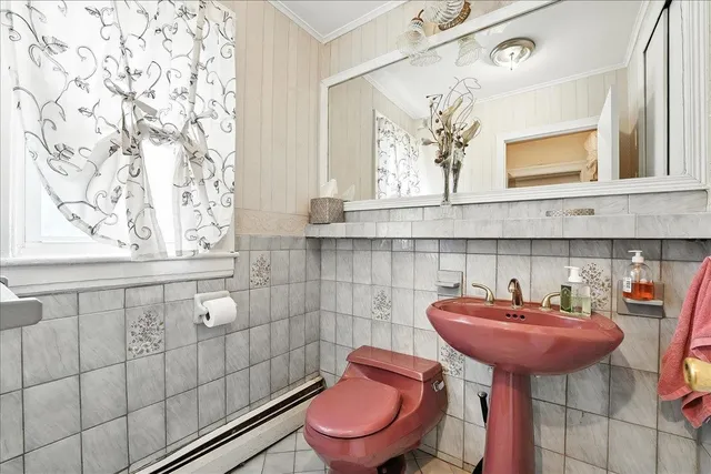 a bedroom with furniture and a flat screen tv