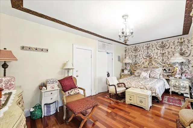 a living room with furniture and a lamp