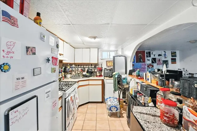 a view of table and chairs under an umbrella