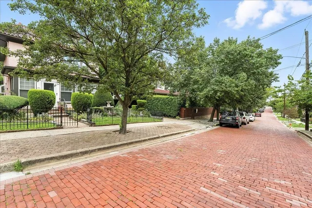 an aerial view of a city with lake view