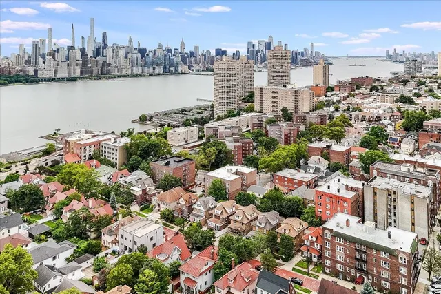 an aerial view of a city with lake view