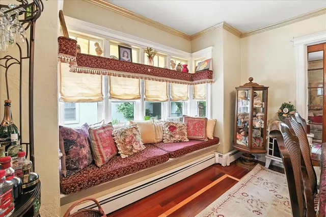 a view of a kitchen with stainless steel appliances granite countertop a stove a sink and a chandelier