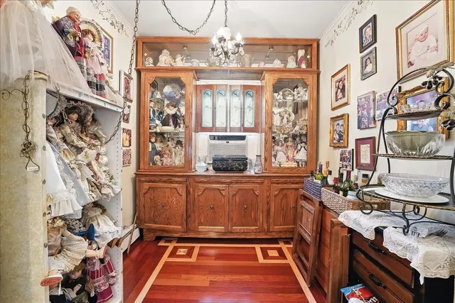 a living room with fireplace furniture and a chandelier