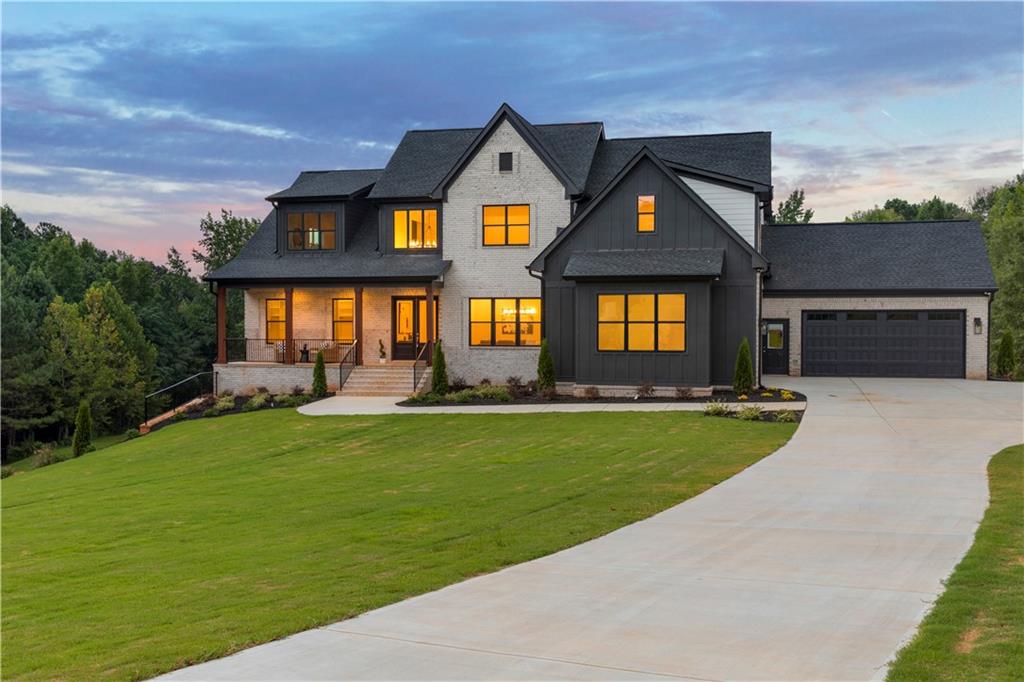 3300 Jack Glass Road Monroe, GA 30656 - Photo 2 of 54 a front view of a house with swimming pool having outdoor seating