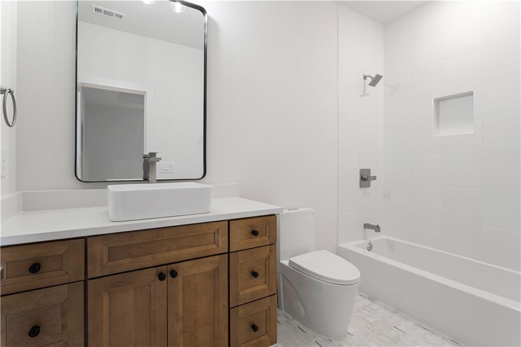 3300 Jack Glass Road Monroe, GA 30656 - Photo 21 of 54 a bathroom with a sink a toilet and shower