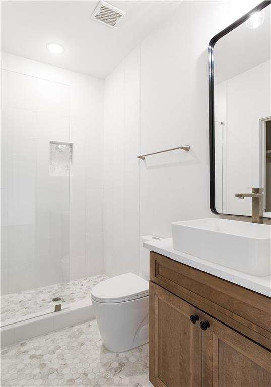 3300 Jack Glass Road Monroe, GA 30656 - Photo 27 of 54 a bathroom with a sink a toilet and shower