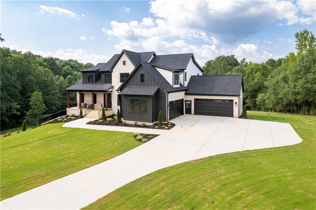 3300 Jack Glass Road Monroe, GA 30656 - Photo 3 of 54 a front view of a house with swimming pool having outdoor seating