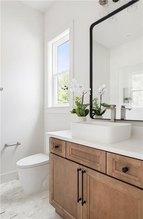 3300 Jack Glass Road Monroe, GA 30656 - Photo 34 of 54 a bathroom with a toilet a sink and a mirror