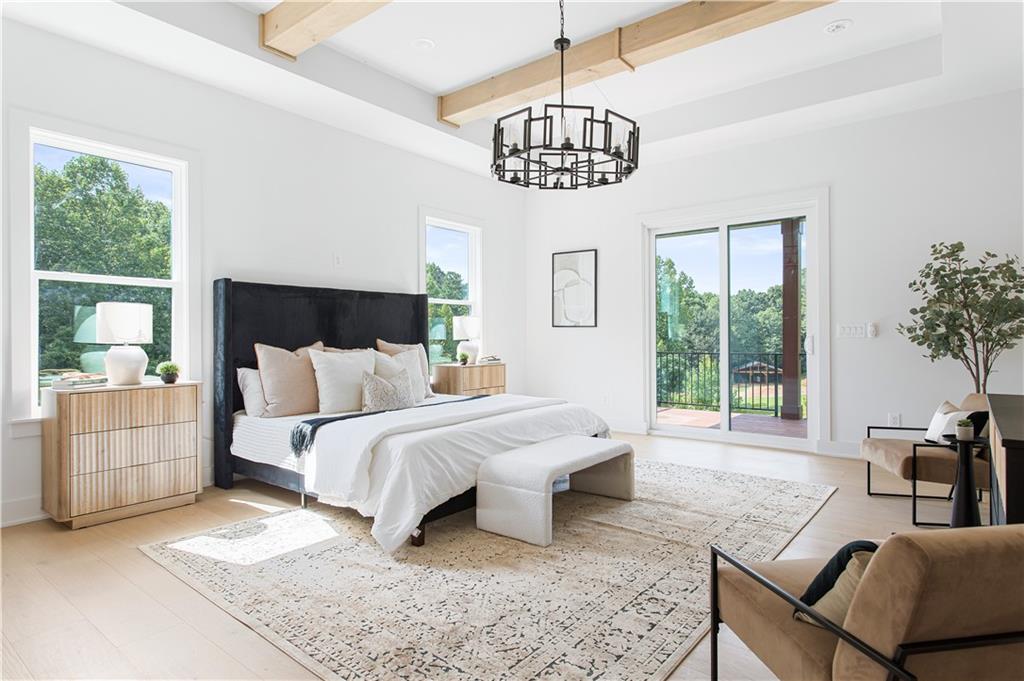 3300 Jack Glass Road Monroe, GA 30656 - Photo 41 of 54 a spacious bedroom with a bed and a couch