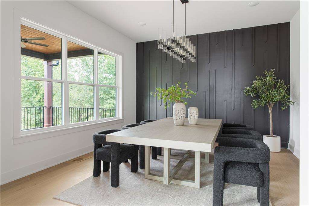 3300 Jack Glass Road Monroe, GA 30656 - Photo 44 of 54 a view of a dining room with furniture window and wooden floor