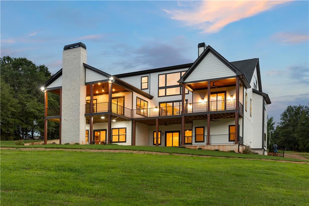 3300 Jack Glass Road Monroe, GA 30656 - Photo 48 of 54 a front view of a house with a yard
