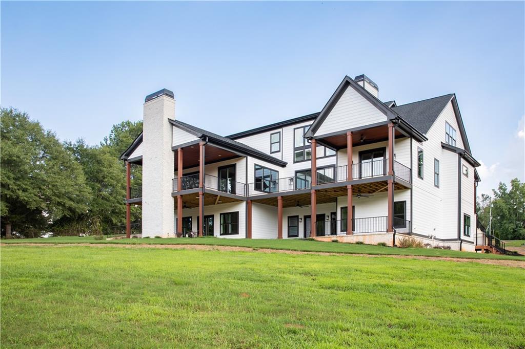 3300 Jack Glass Road Monroe, GA 30656 - Photo 49 of 54 front view of house with a yard