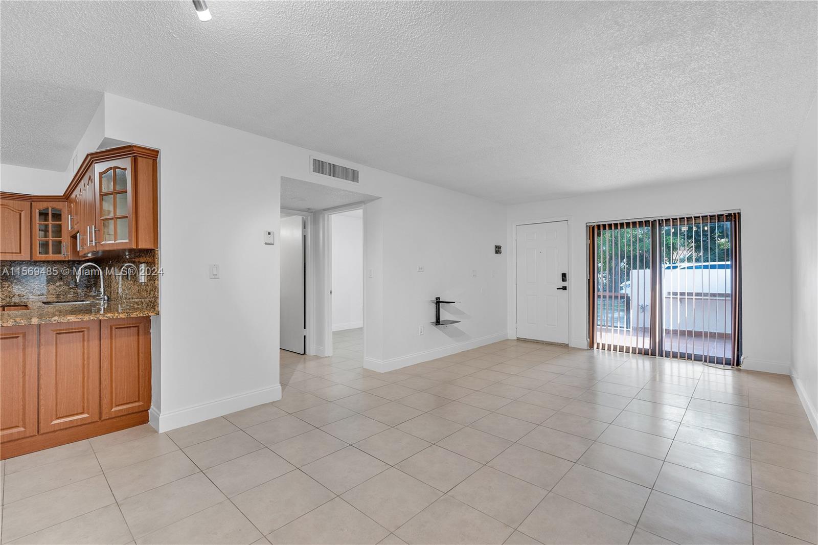 7540 Southwest 153rd Place, Unit 1029 Miami, FL 33193 - Photo 16 of 28 a view of a kitchen with a sink and cabinet