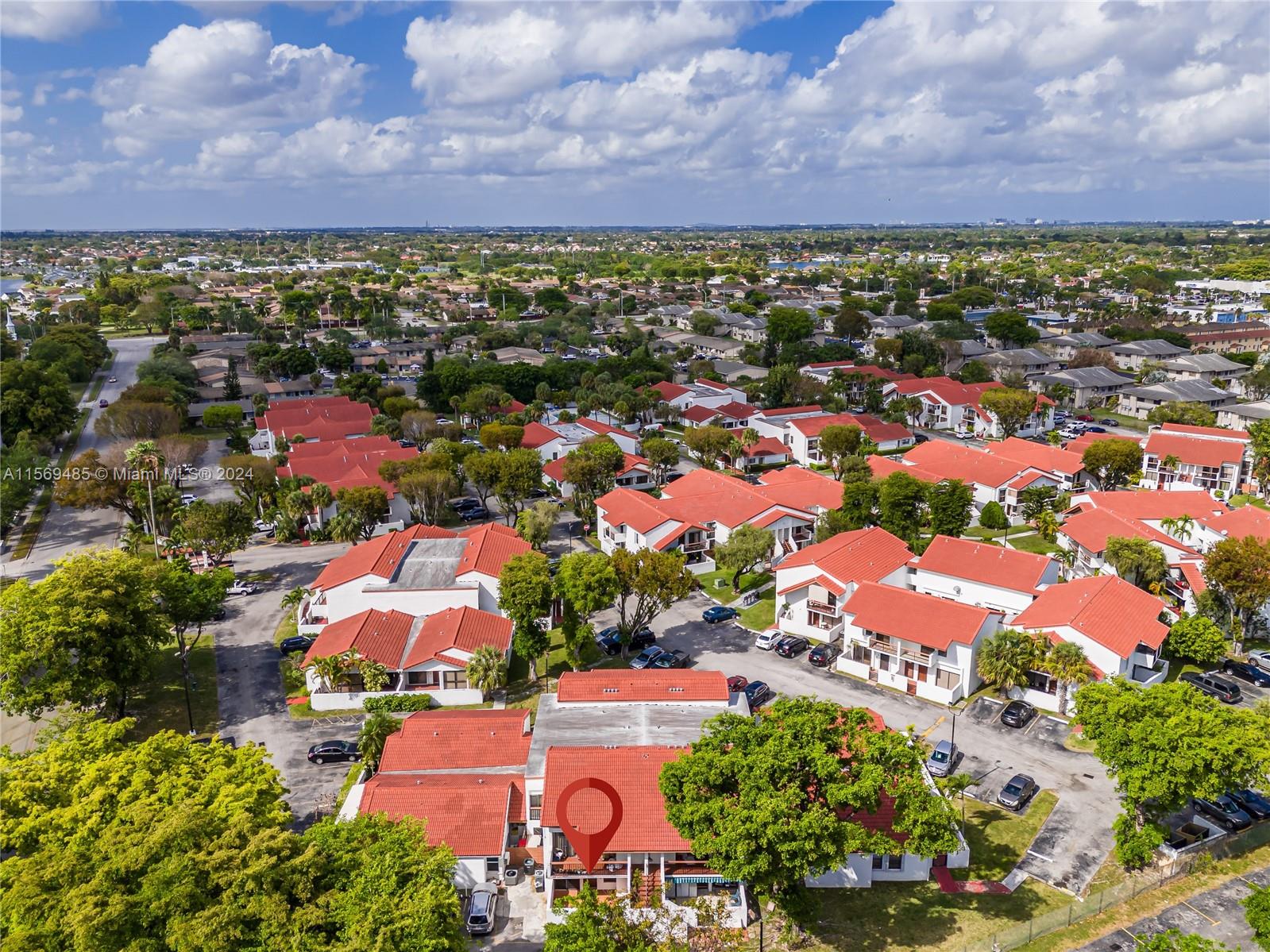 7540 Southwest 153rd Place, Unit 1029 Miami, FL 33193 - Photo 3 of 28 an aerial view of residential building and car parked