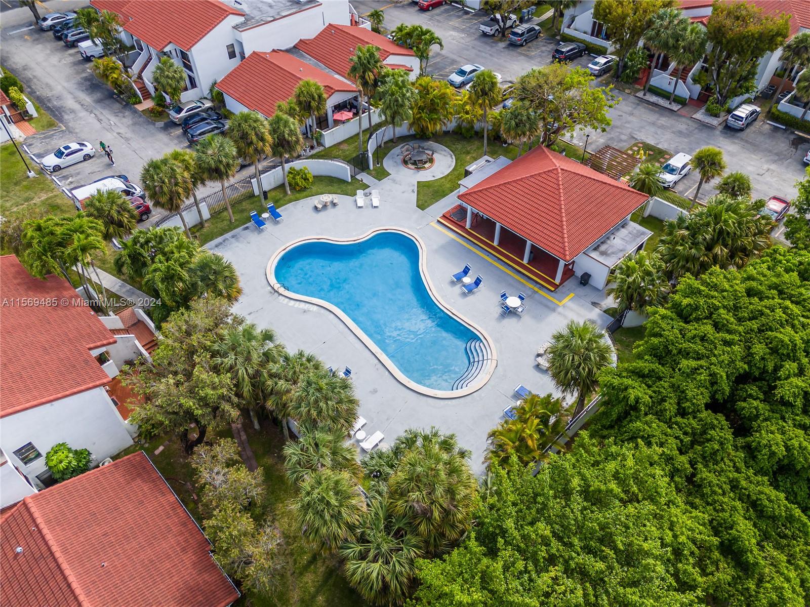 7540 Southwest 153rd Place, Unit 1029 Miami, FL 33193 - Photo 5 of 28 an aerial view of a house roof deck and outdoor seating