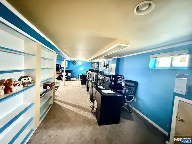 a kitchen with a sink appliances and cabinets