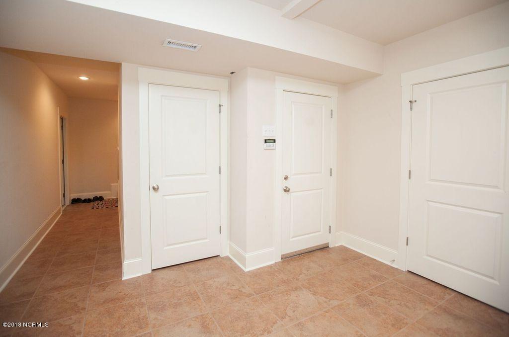 209 Inlet Point Drive Wilmington, NC 28409 - Photo 27 of 50 elevator shaft door on ground floor.