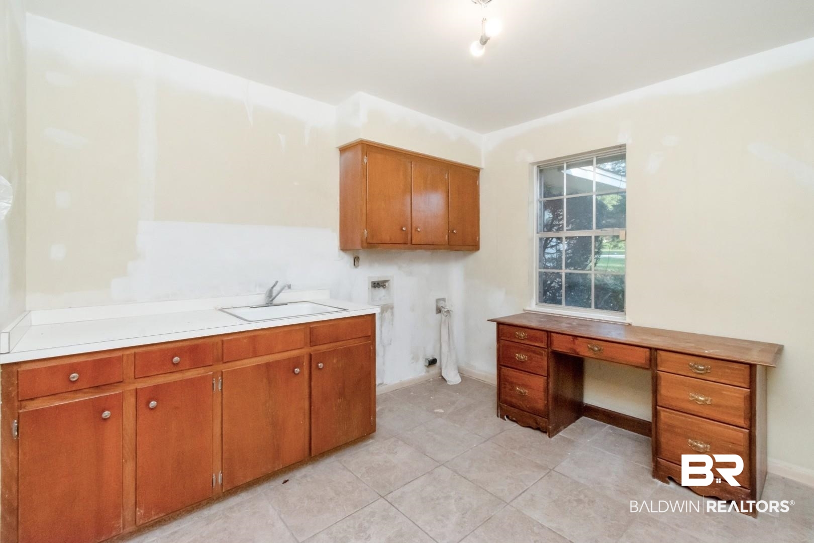 241 Suzanne Circle Mobile, AL 36608 - Photo 26 of 41 Laundry room with cabinet space, washer hookup, an office area, and light tile patterned floors