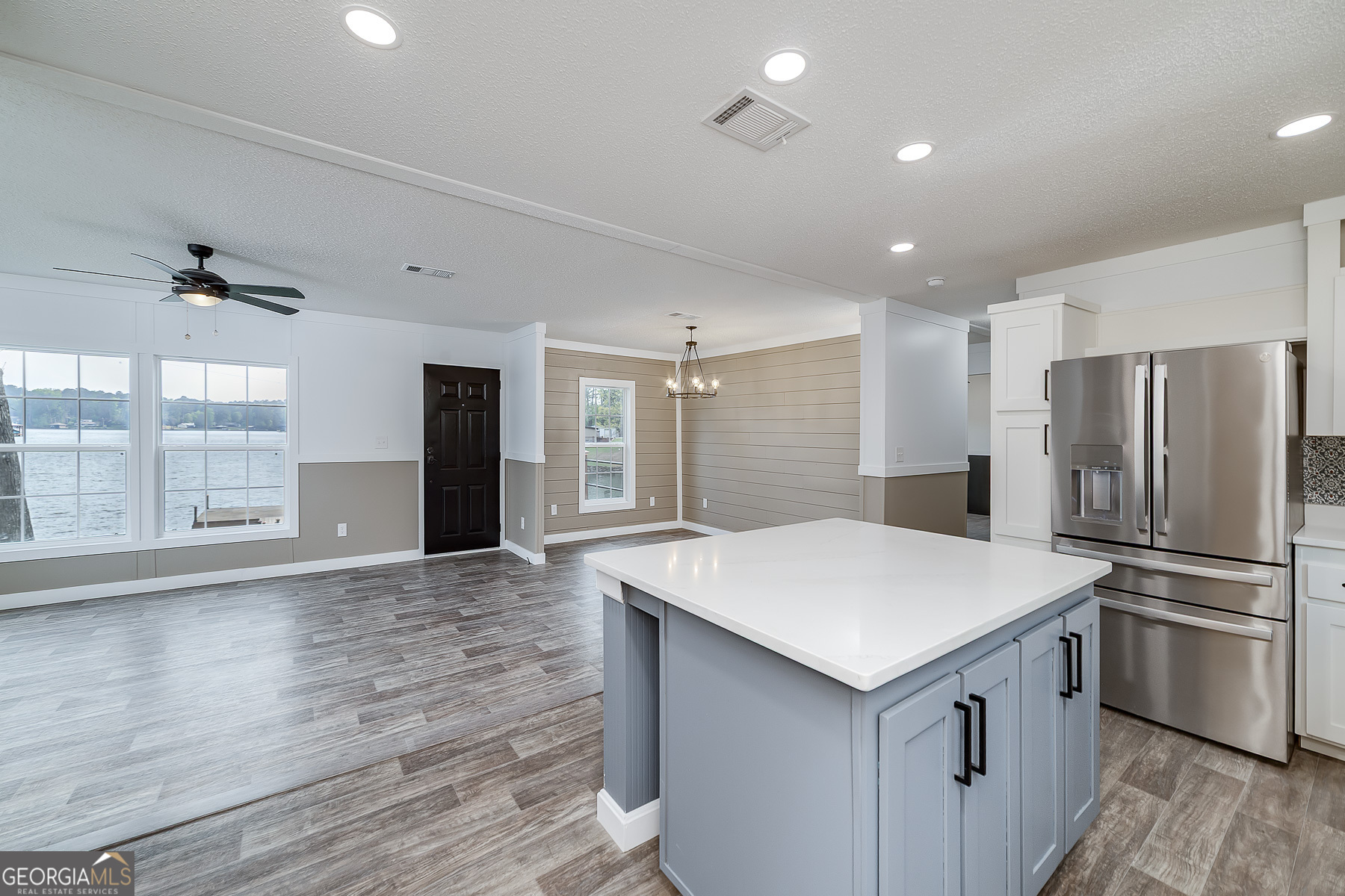 595 Barnetts Bridge Road Jackson, GA 30233 - Photo 22 of 47 a kitchen with kitchen island a sink appliances and cabinets