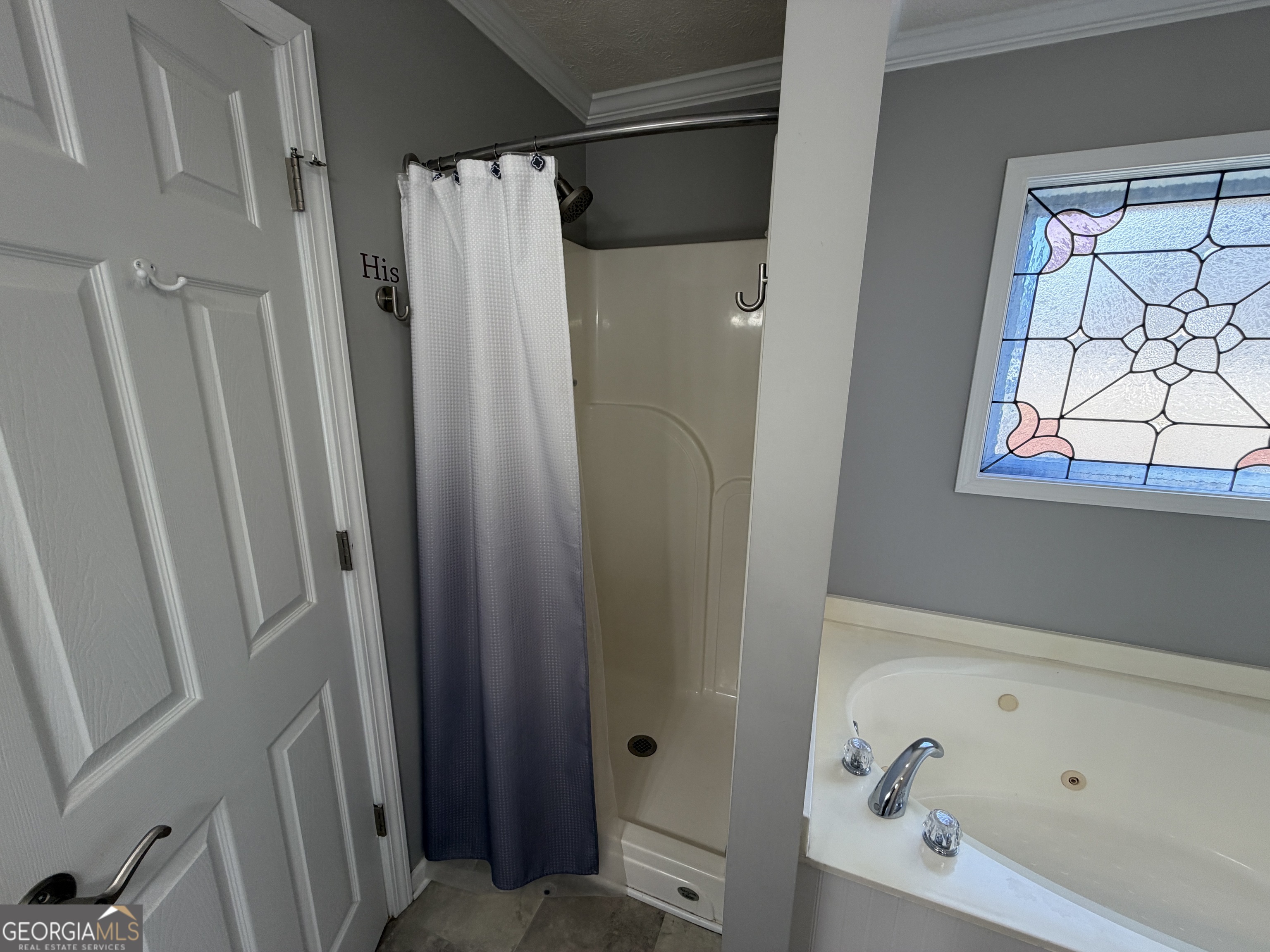 3603 Garden Lakes Parkway Rome, GA 30165 - Photo 14 of 22 a bathroom with a tub and a shower