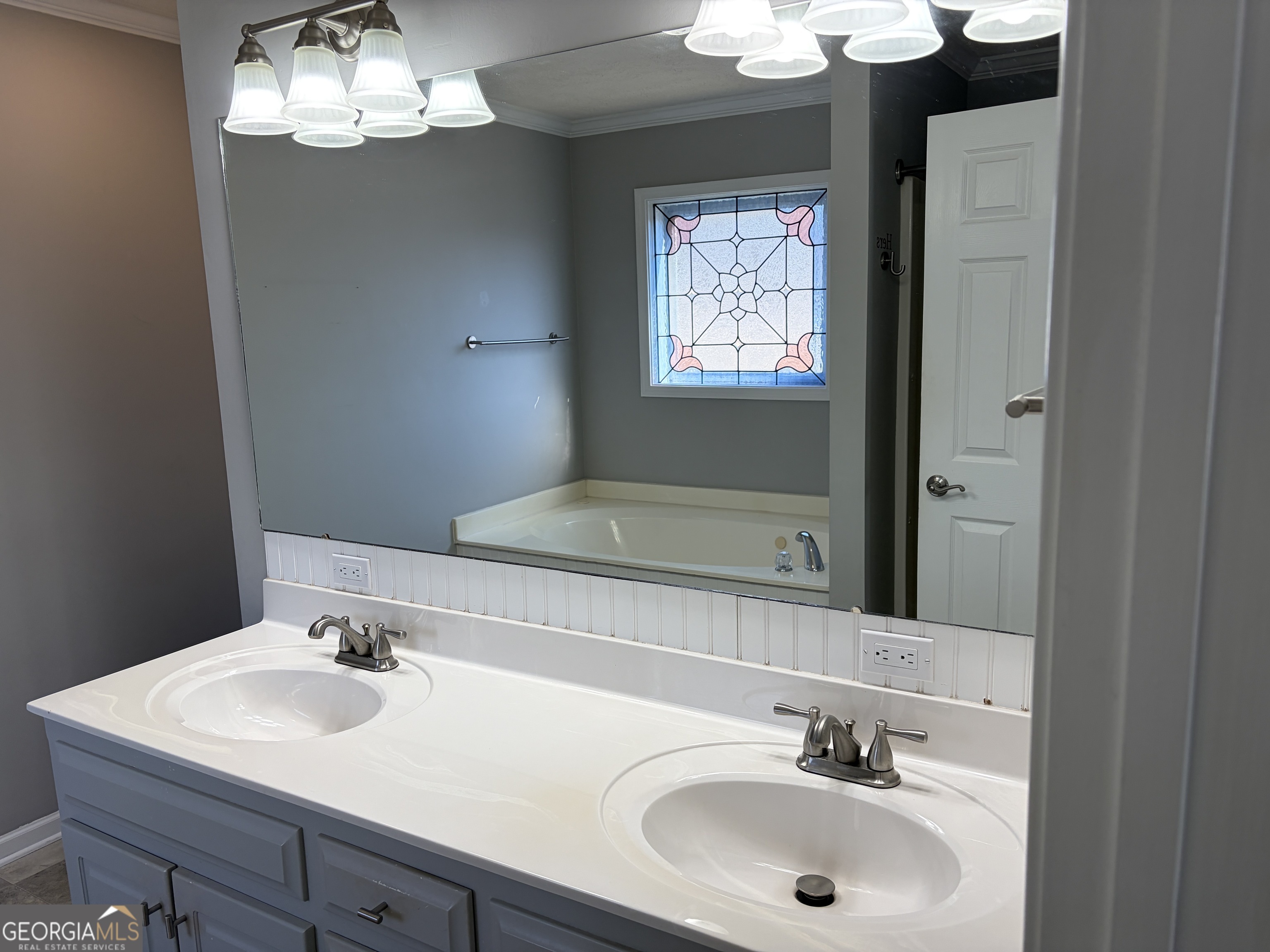 3603 Garden Lakes Parkway Rome, GA 30165 - Photo 16 of 22 a bathroom with a sink and a mirror