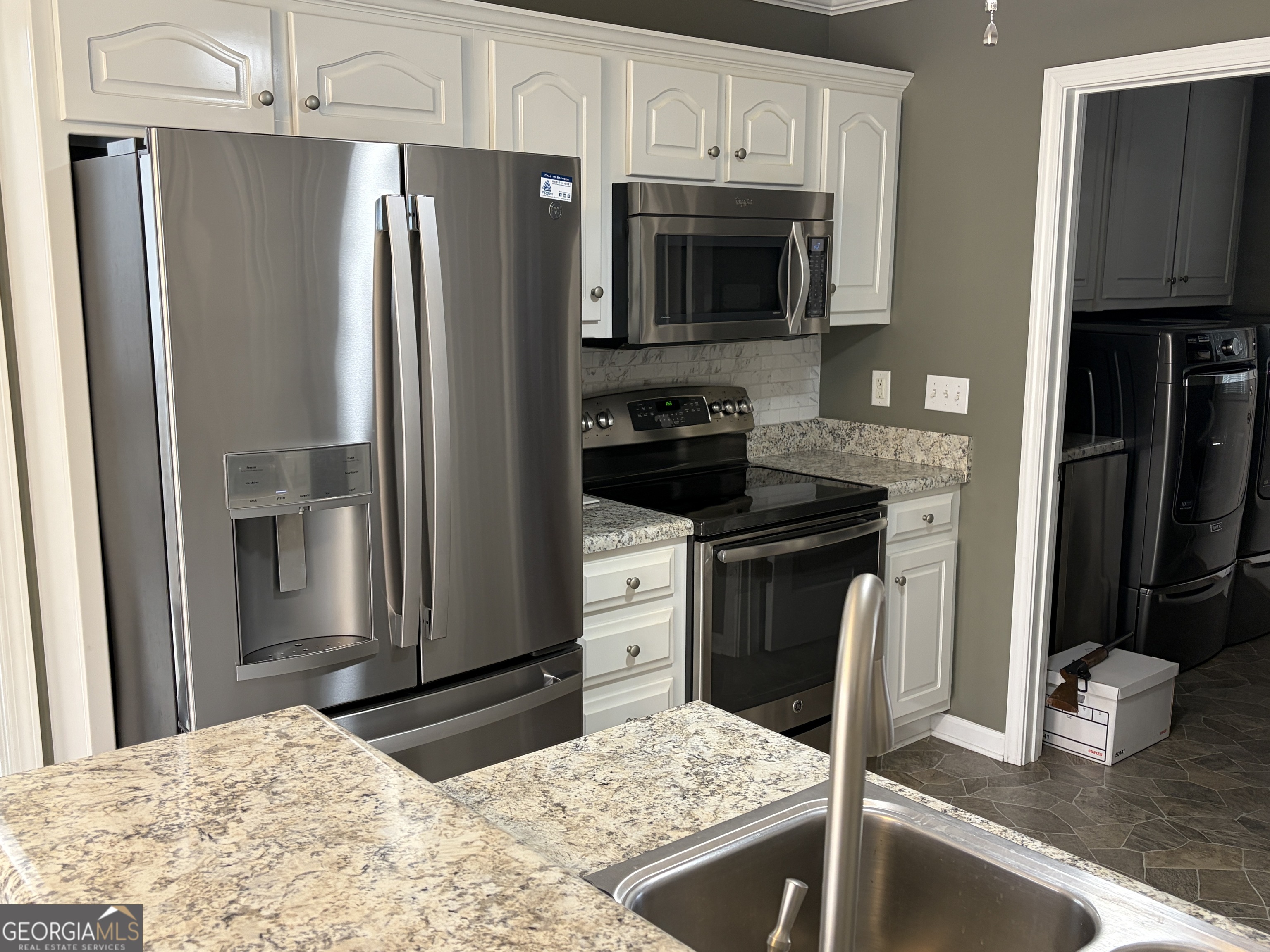 3603 Garden Lakes Parkway Rome, GA 30165 - Photo 6 of 22 a kitchen with a refrigerator sink and microwave