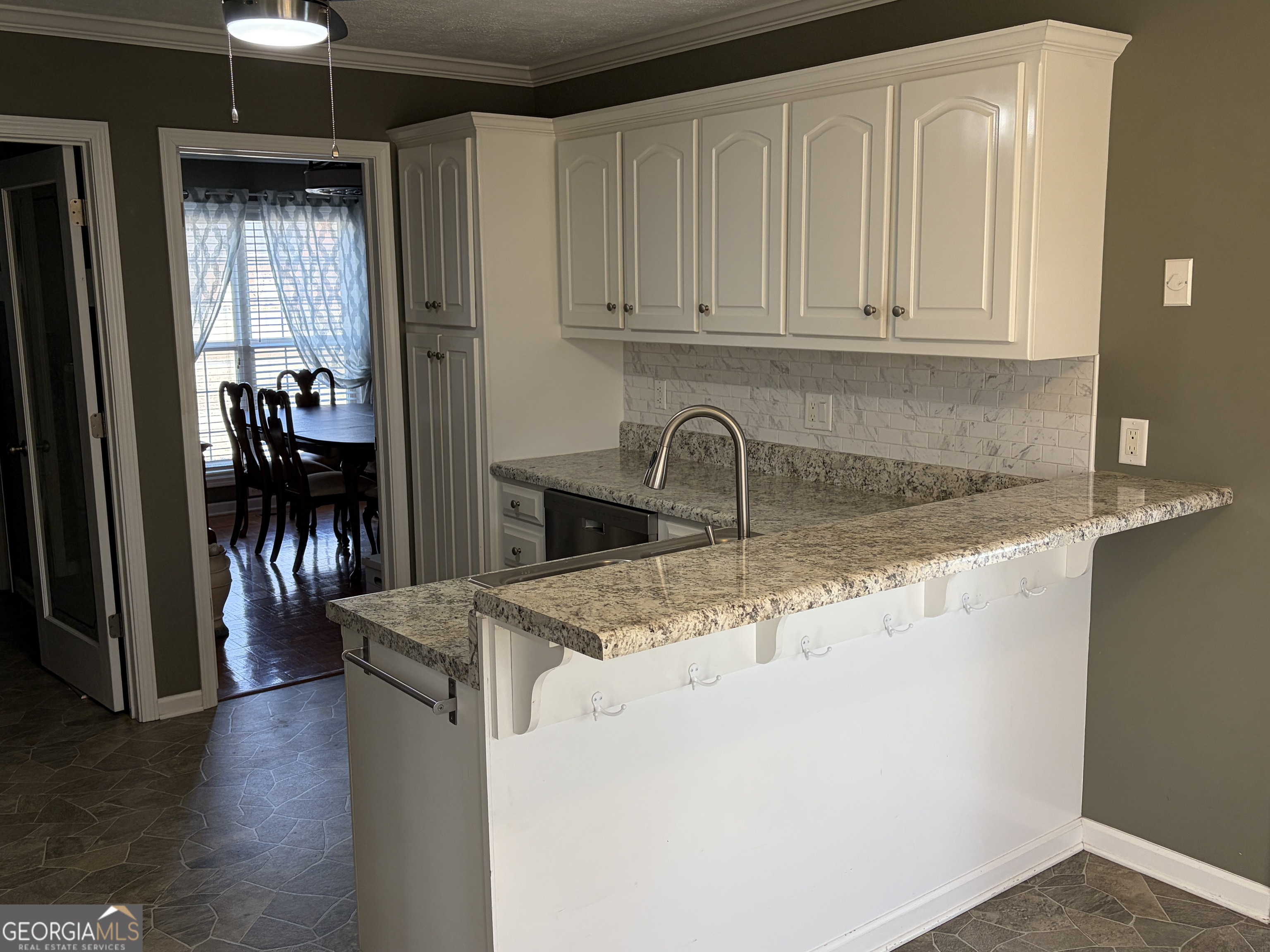 3603 Garden Lakes Parkway Rome, GA 30165 - Photo 7 of 22 a kitchen with stainless steel appliances granite countertop a sink and a refrigerator