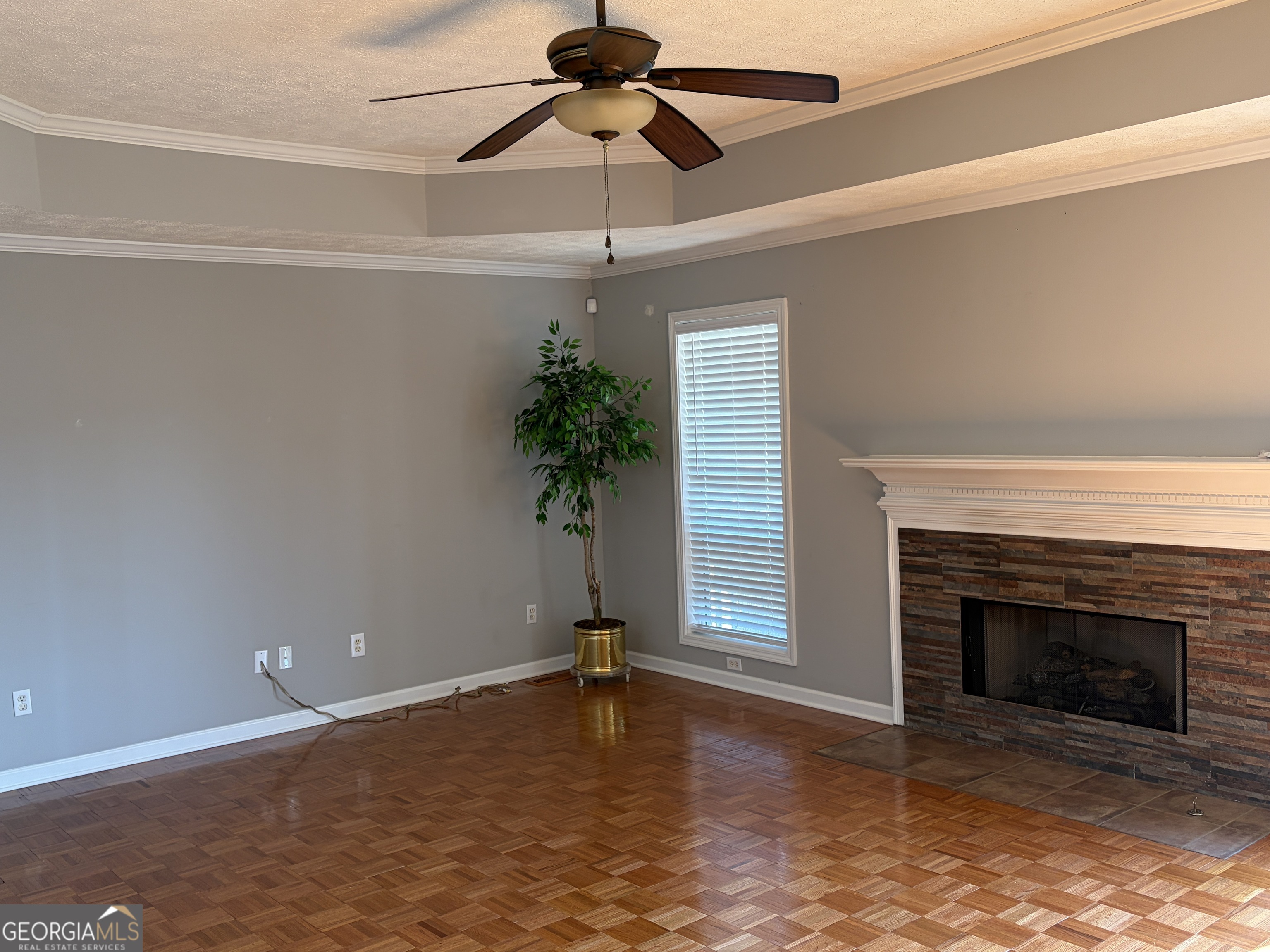 3603 Garden Lakes Parkway Rome, GA 30165 - Photo 10 of 22 a view of a livingroom with a fireplace and a ceiling fan
