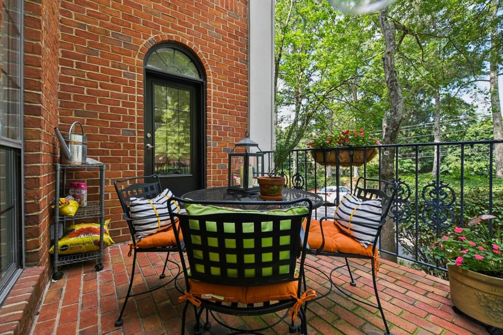 2921 Lenox Road Northeast, Unit 103 Atlanta, GA 30324 - Photo 31 of 37 a view of a chairs and table in the patio