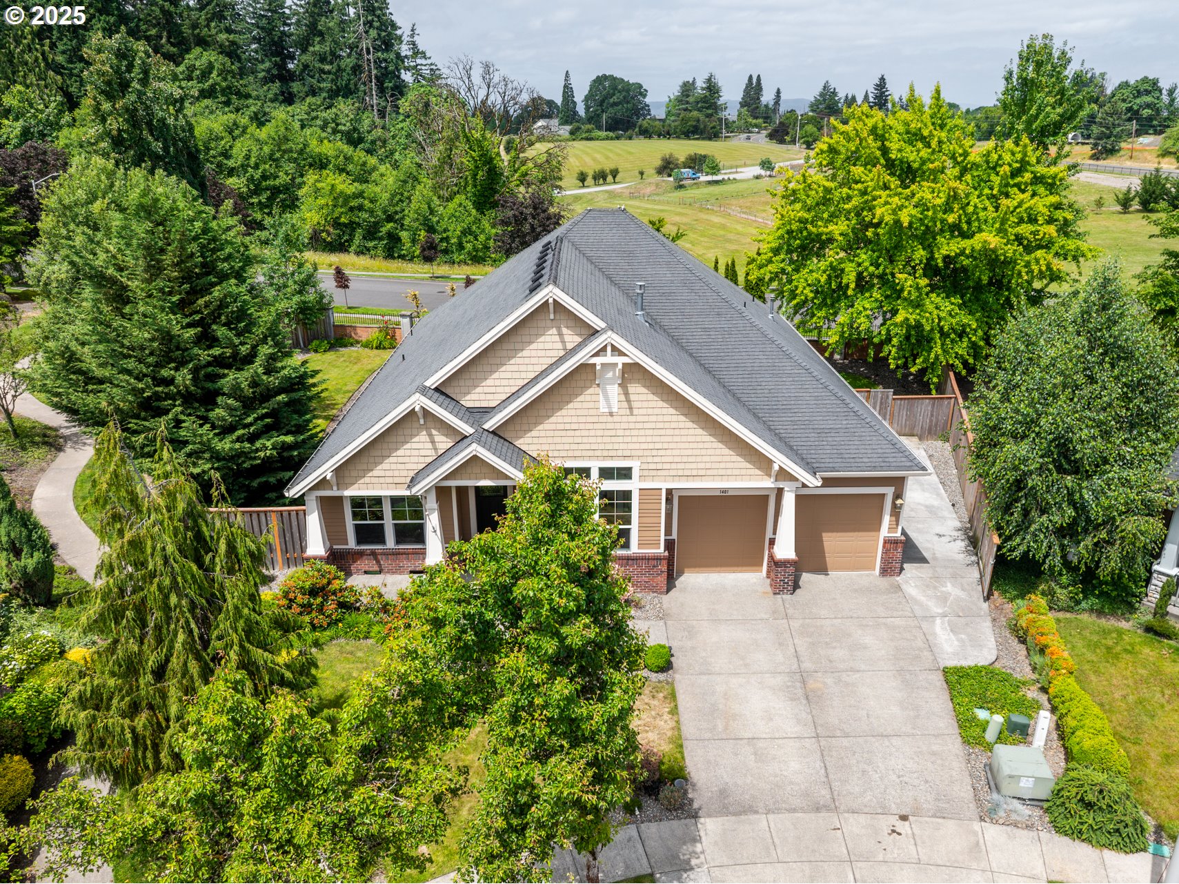 1401 South Dusky Drive Ridgefield, WA 98642 - Photo 3 of 46 a house view with a garden space