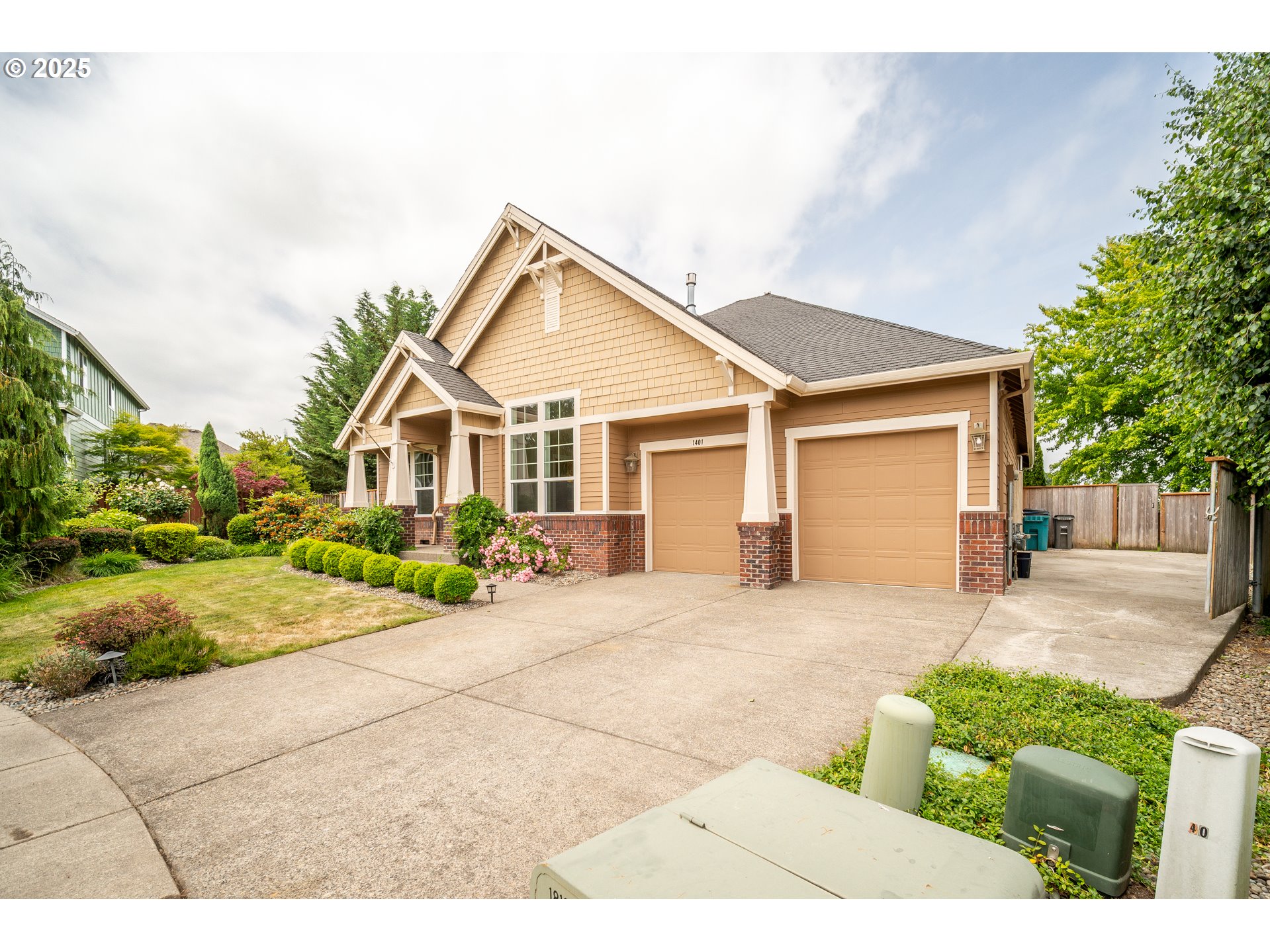 1401 South Dusky Drive Ridgefield, WA 98642 - Photo 4 of 46 a view of a house with a yard and potted plants