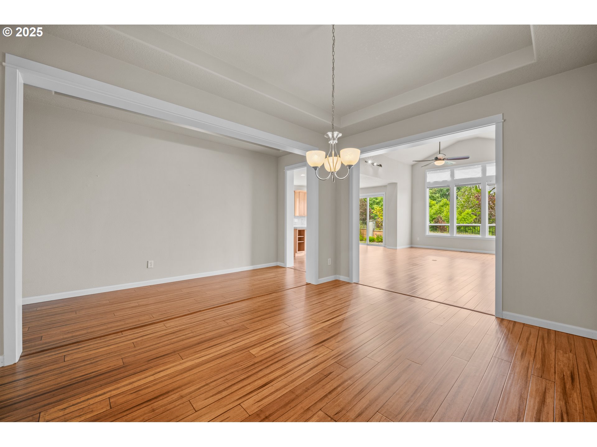 1401 South Dusky Drive Ridgefield, WA 98642 - Photo 10 of 46 a view of an empty room with window and wooden floor