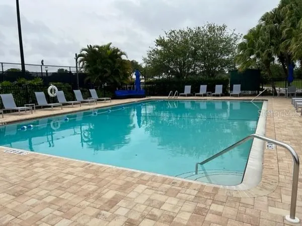 a view of swimming pool with a patio