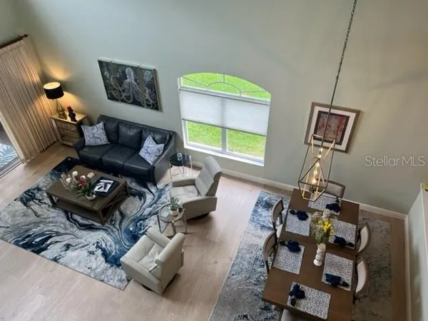 a living room with furniture and a window