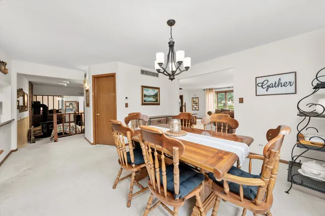 a view of a livingroom with furniture and a kitchen