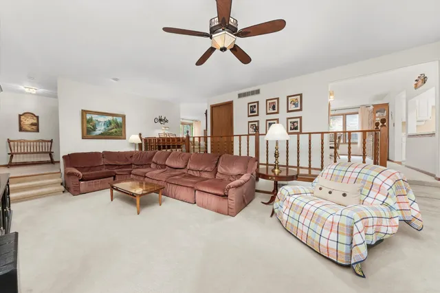 a view of a livingroom with furniture and a window