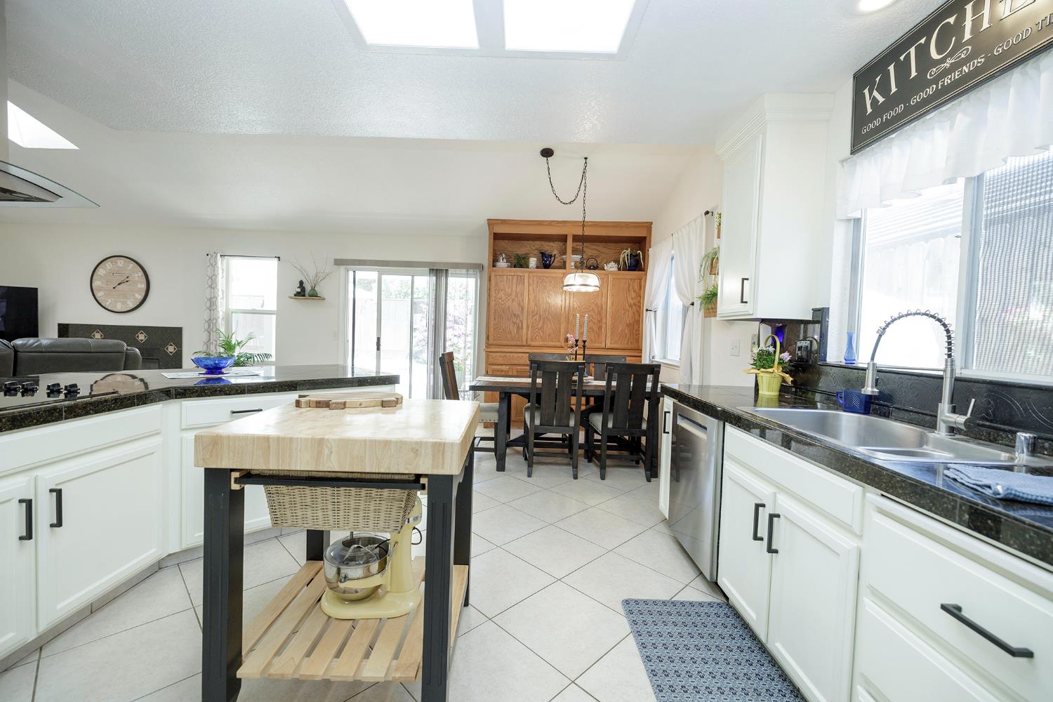 230 Meyenberg Avenue Ripon, CA 95366 - Photo 28 of 52 a kitchen with cabinets and chairs