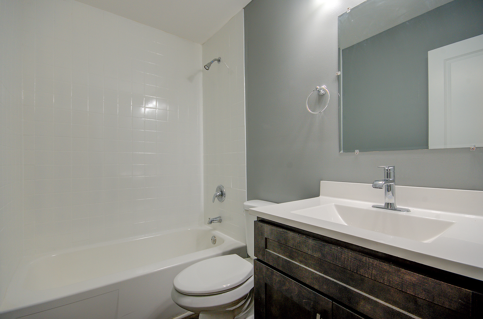 2302 Carnation Drive, Unit 317C Crest Hill, IL 60403 - Photo 9 of 17 a bathroom with a sink a toilet and bathtub