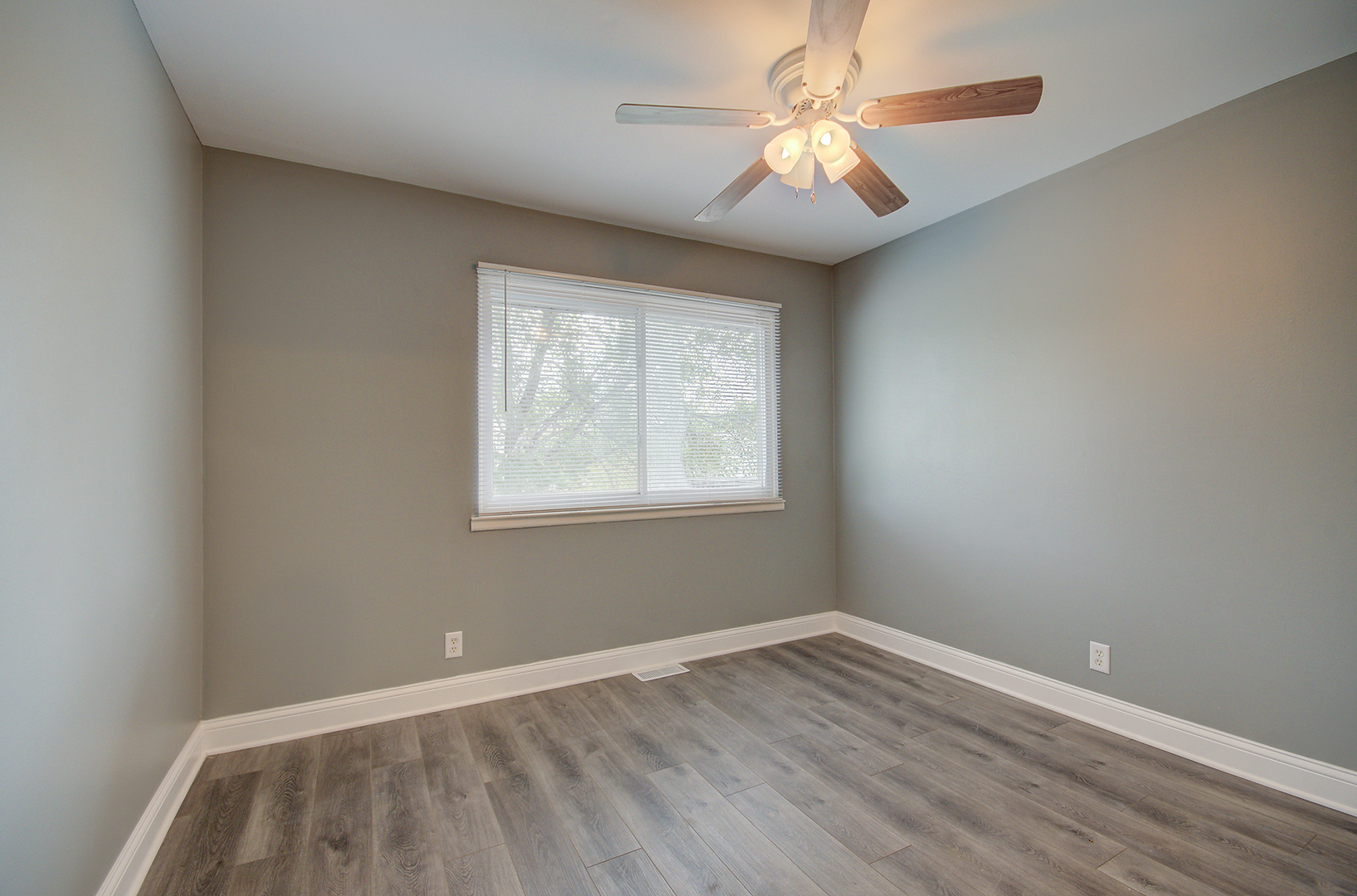 2302 Carnation Drive, Unit 317C Crest Hill, IL 60403 - Photo 10 of 17 wooden floor in an empty room with a window
