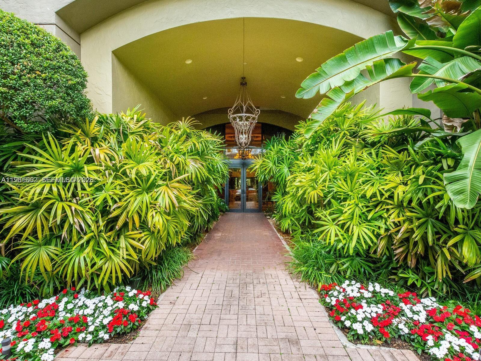 888 Douglas Road, Unit 1401 Coral Gables, FL 33134 - Photo 25 of 43 a view of a pathway in a garden