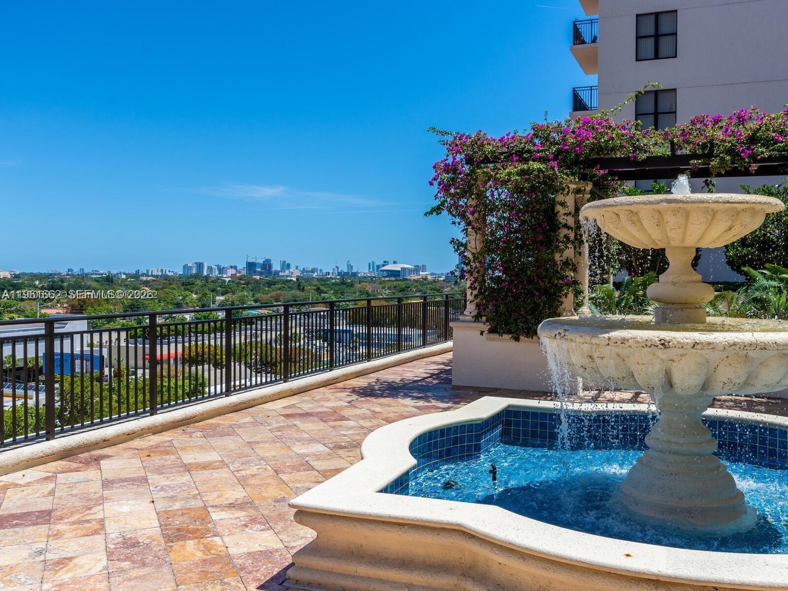 888 Douglas Road, Unit 1401 Coral Gables, FL 33134 - Photo 26 of 43 a view of swimming pool with outdoor seating and plants