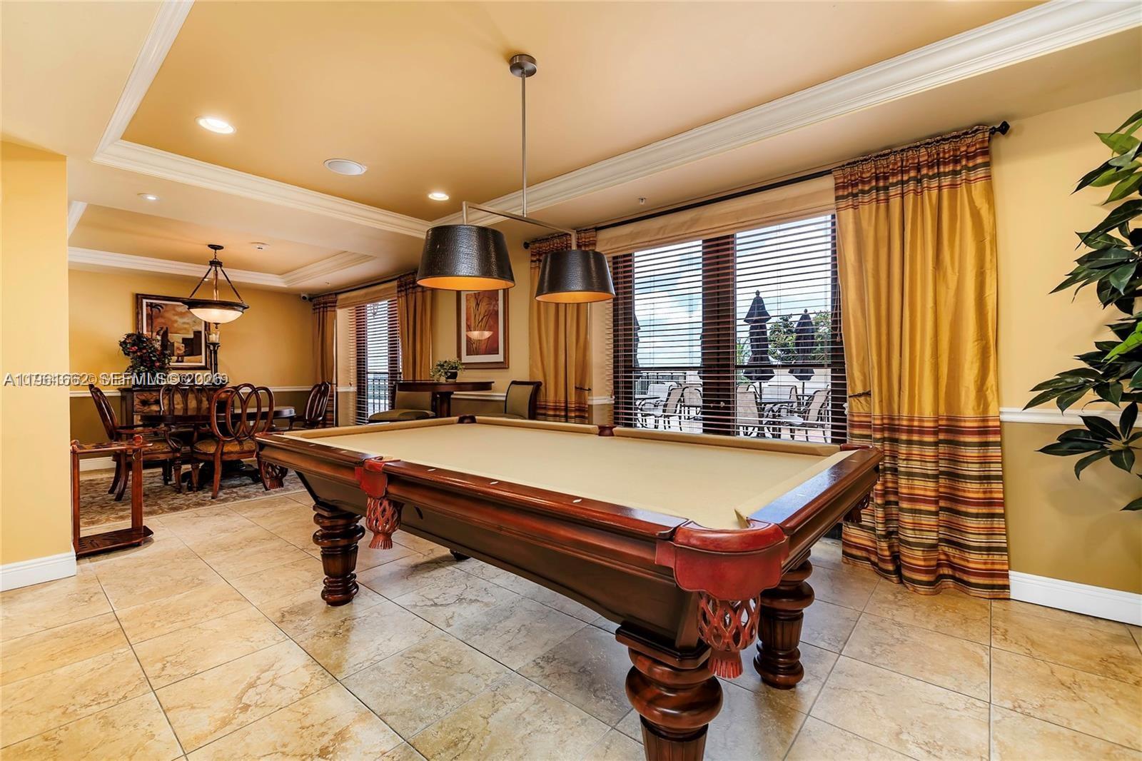 888 Douglas Road, Unit 1401 Coral Gables, FL 33134 - Photo 30 of 43 a room with pool table and windows