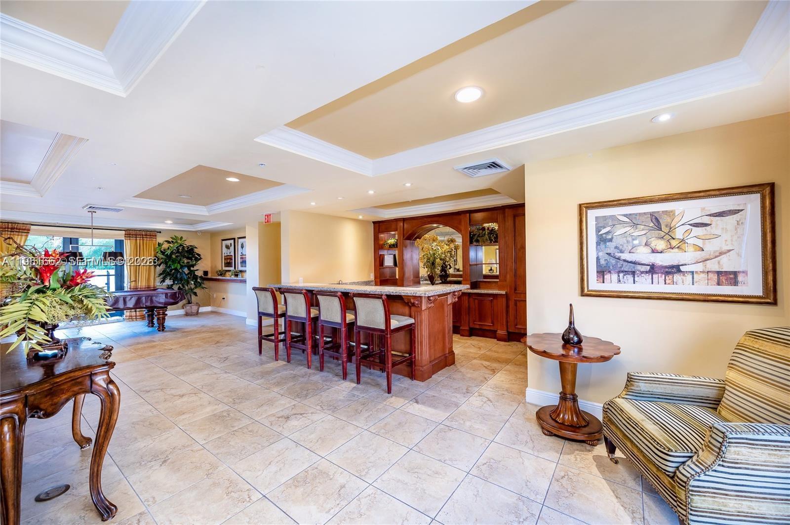 888 Douglas Road, Unit 1401 Coral Gables, FL 33134 - Photo 32 of 43 a view of a living room and dining room